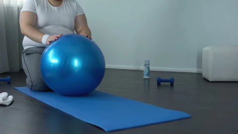 Obese hardworking man practicing static exercise, strength training program Stock Footage 89509528