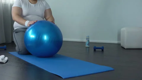 Obese hardworking man practicing static exercise, strength training program Stock Footage 89527186