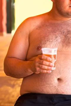 Obese man with beer Stock Photos