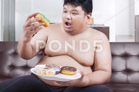 Obese Man Eating Donuts