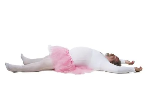 Obese man in tutu lying down Foto stock