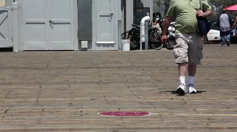 Obese man walking toward camera Stock Footage 11840905