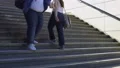 Obese people walking on stairs, overweight problem among youth, consumerism 4k or 4k+ Resolution