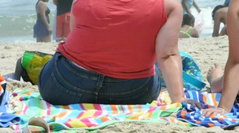 Obese Woman from Behind on the Beach Stock Footage