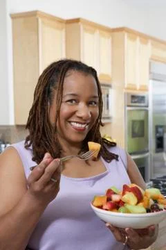 Obese Woman Having Fruit Salad Stock Photos
