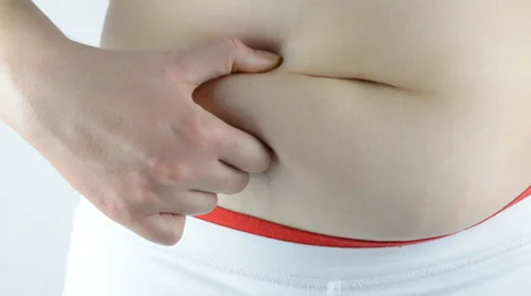 Obese  young lady checking her fats Video stock 37818718