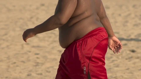 Obese Young Man on the Beach Stock Footage