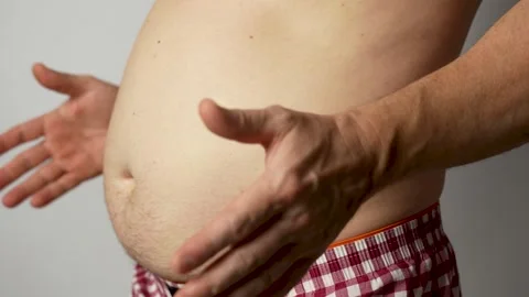 Obesity man touching his belly. Stock Footage 253376584