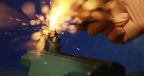 The Object Is Clamped In A Vise A Man With A Grinding Machine With A Sliced Disk Stock Footage 125921731