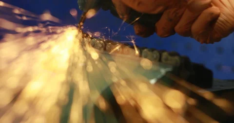 The Object Is Clamped In A Vise A Man With A Grinding Machine With A Sliced Disk Stock Footage 125921738