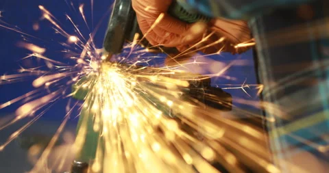 The Object Is Clamped In A Vise A Man With A Grinding Machine With A Sliced Disk Stock Footage 125921749