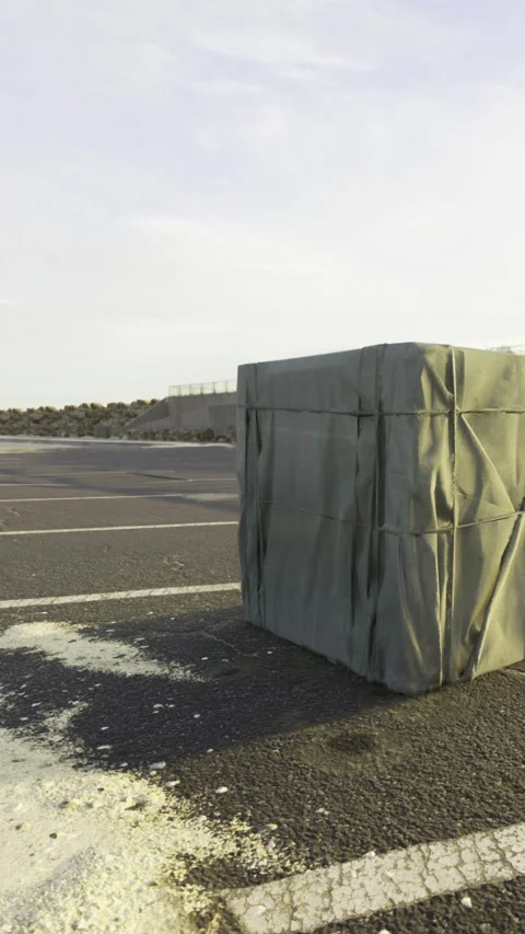 Object covers empty parking lot at a desert location during daytime Stock-Footage 334167410