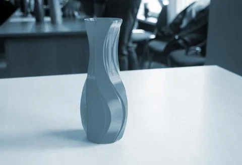 Object form vase of blue color printed on a 3D printer. Three-dimensional model Stock Photos
