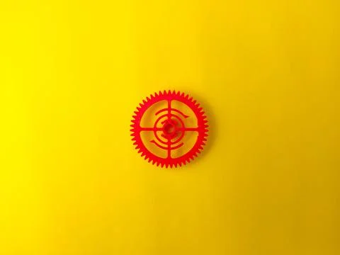 The object in the image appears to be a 3D printed red gear Stock Photos