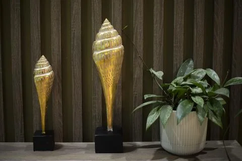 An object in the interior. Golden shell. Interior details. Stock Photos