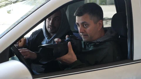 The object of observation is being watched by private investigators or spies. A Stock Footage 154555214