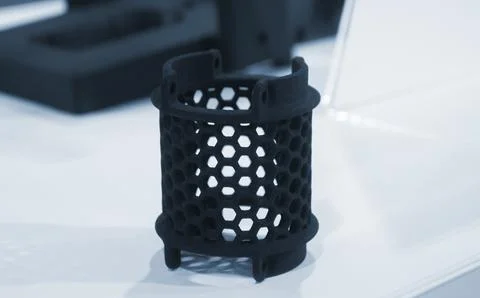 Object printed on 3D printer from molten plastic powder close-up. Model printed Stock Photos