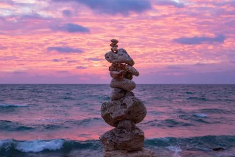 The object of the stones on the beach at sunset. Stock Photos