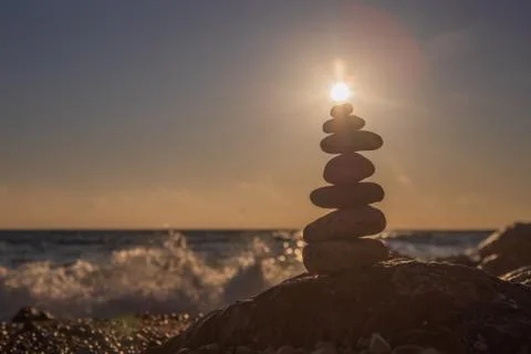 Object of the stones on the beach at sunset Stock Photos