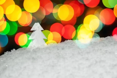Object white foam Christmas tree in snow. with colorful Christmas round the s Foto stock