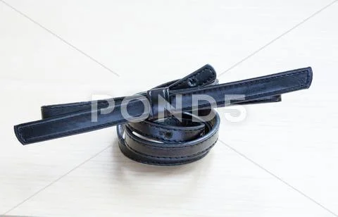 Object on wooden background - waist-belt close up Stock Photos