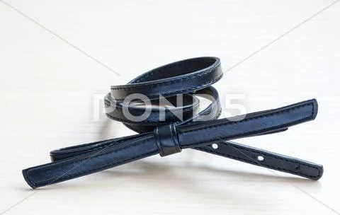 Object on wooden background - waist-belt close up Stock Photos