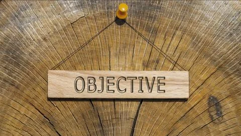 Objective word. Background log written on wooden board Stock Photos
