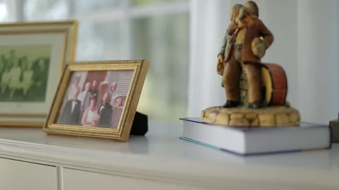 Objects arranged on a chest of a drawers in a  bedroom. Vidéo 88342598