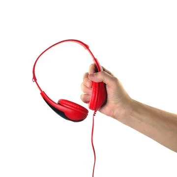 Objects Hands action - Hand holds Headphones. Isolated Stock Photos