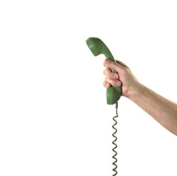 Objects Hands action - Hand holds retro phone green handset. Isolated Stock Photos