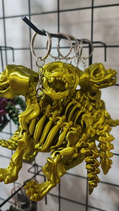 Objects keychains form dog skeleton models toys printed on 3D printer. Vertical Stockbeeldmateriaal 303881352