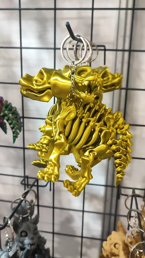 Objects keychains in form of dog skeleton models of toys printed on 3D printer Stock-Footage 304917485