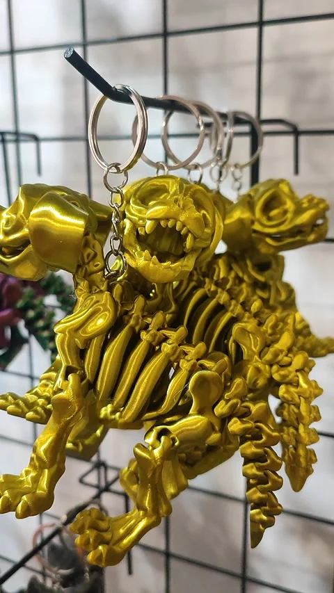 Objects keychains form dog skeleton models toys printed on 3D printer. Vertical Stock Footage 304917759