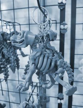 Objects keychains form dog skeleton models toys printed 3D printer. Blue color Stock Photos