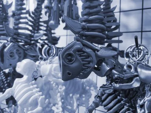 Objects keychains form fish skeleton, models toys printed 3D printer Blue color Stock Photos