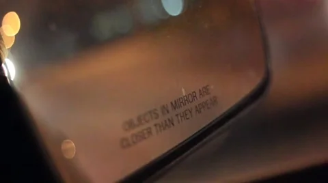 Objects in mirror are closer than they appear at night driving Stock Footage 47465641