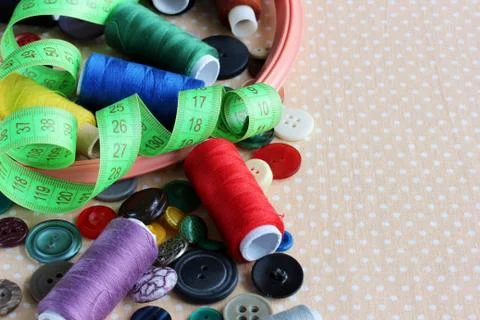 Objects for needlework: buttons, threads, hoops and tape for measuring Stock Photos