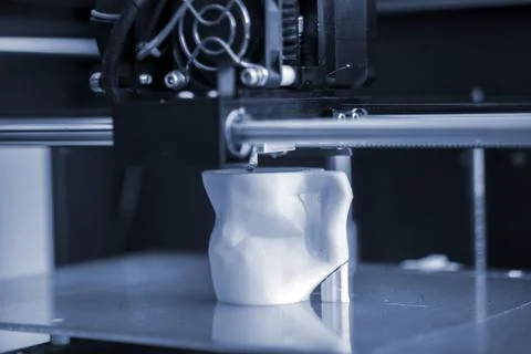 Objects printed by 3d printer. Automatic three dimensional 3d printer performs Stock Photos