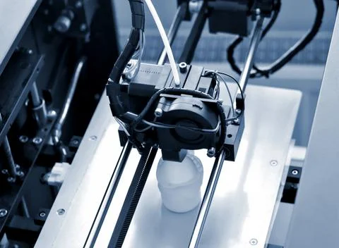 Objects printed by 3d printer. Automatic three dimensional 3d printer performs Stock Photos
