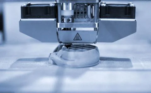 Objects printed by 3d printer. Automatic three dimensional 3d printer performs Stock Photos