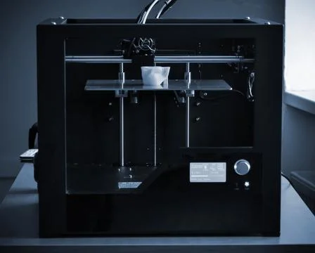 Objects printed by 3d printer. Automatic three dimensional 3d printer performs Stock Photos