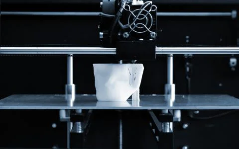 Objects printed by 3d printer. Automatic three dimensional 3d printer Stock Photos