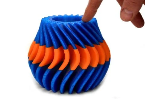 Objects printed by 3d printer Isolated on white background with a human hand. Stock Photos