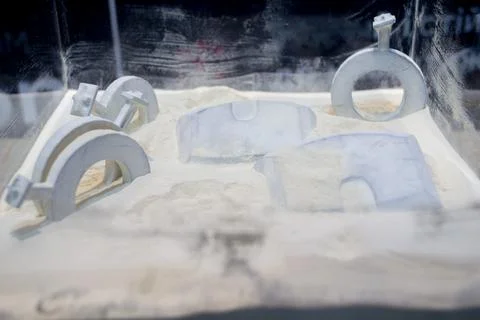 Objects printed 3D printer from powdered polyamide lying white polyamide powder Stock Photos