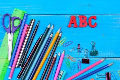 Objects school on blue wooden table Stock Photos