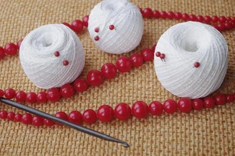 Objects for sewing. Scissors and pins. Hanks thread on mat. Pins Stock Photos