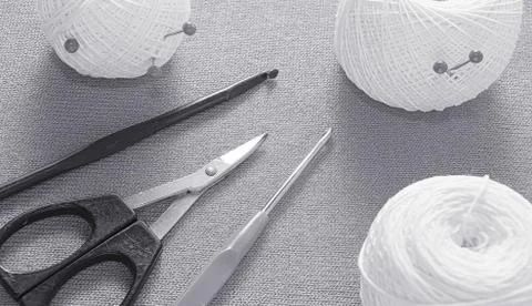 Objects for sewing. Scissors and pins. Hanks thread on mat. Pins Stock Photos