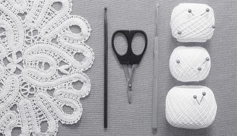 Objects for sewing. Scissors and pins. Hanks thread on mat. Pins Stock Photos