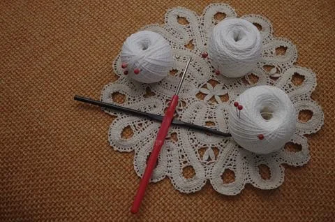 Objects for sewing. Scissors and pins. Hanks thread on mat. Pins Stock Photos