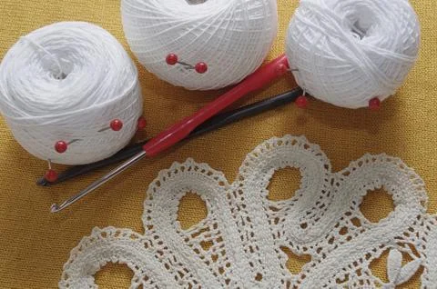 Objects for sewing. Scissors and pins. Hanks thread on mat. Pins Stock Photos